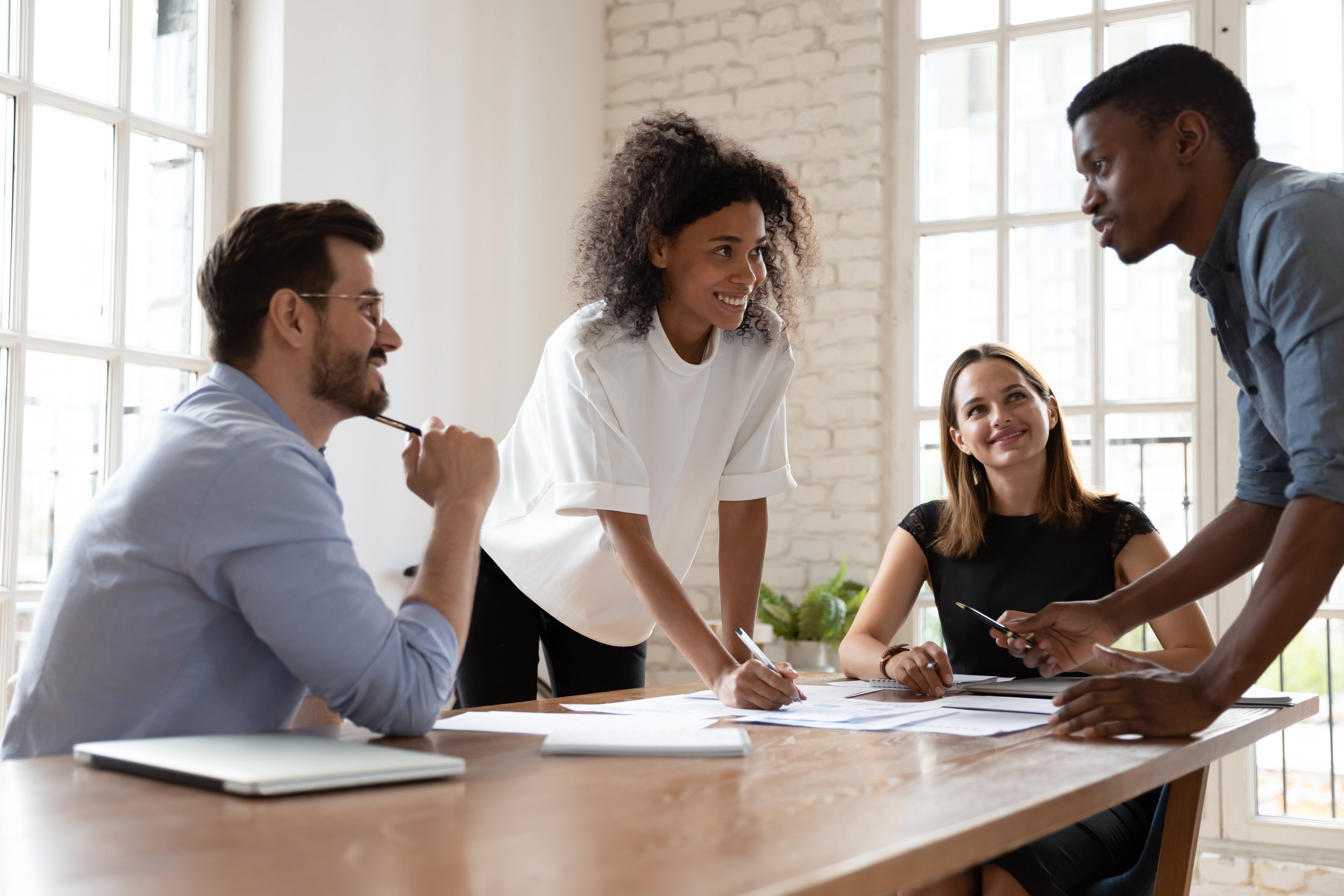 Skilled biracial professional proposing good problem solution.